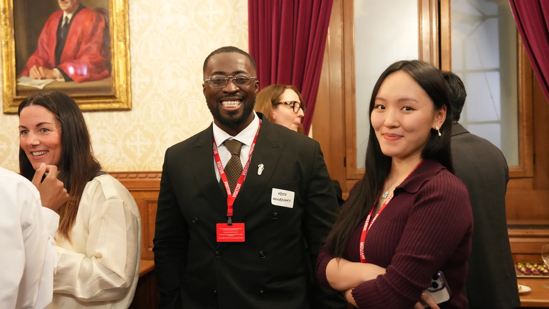 Guests smiling during the reception at the House of Lords